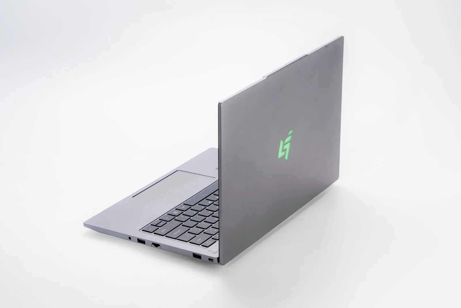 A Citzen CZ-4 notebook photographed open from a rear three-quarter angle against a plain white background, the lid facing the camera.